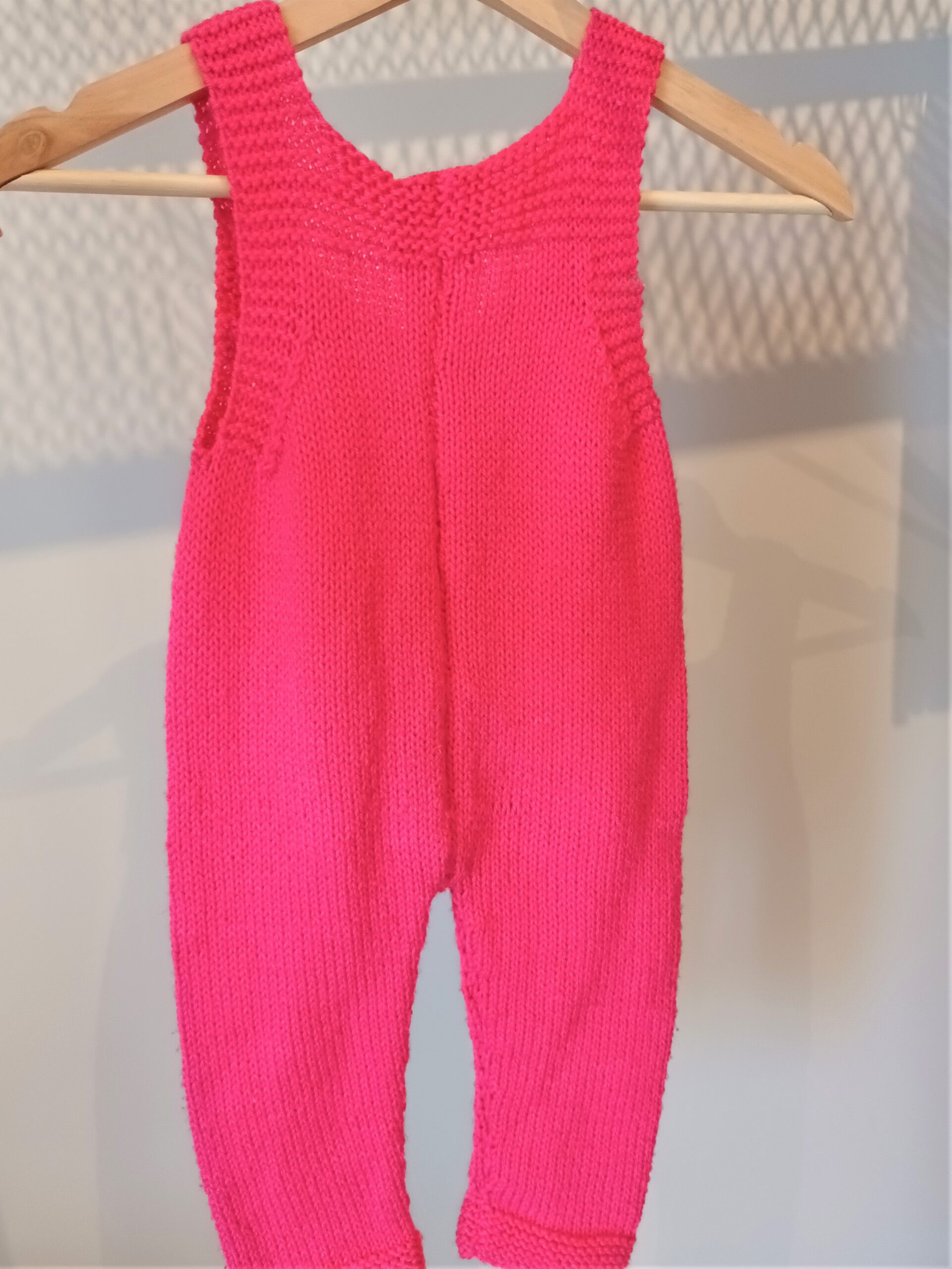 Handmade knitted jumpsuit in fuchsia