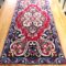 Rectangular tablecloth with embroidery in red with flowers . Dimensions 0,45 x 0,95cm