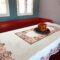Extra large tablecloth with embroidery in lorange and brown with flower patterns. Dimensions 1,40 x 2,20m